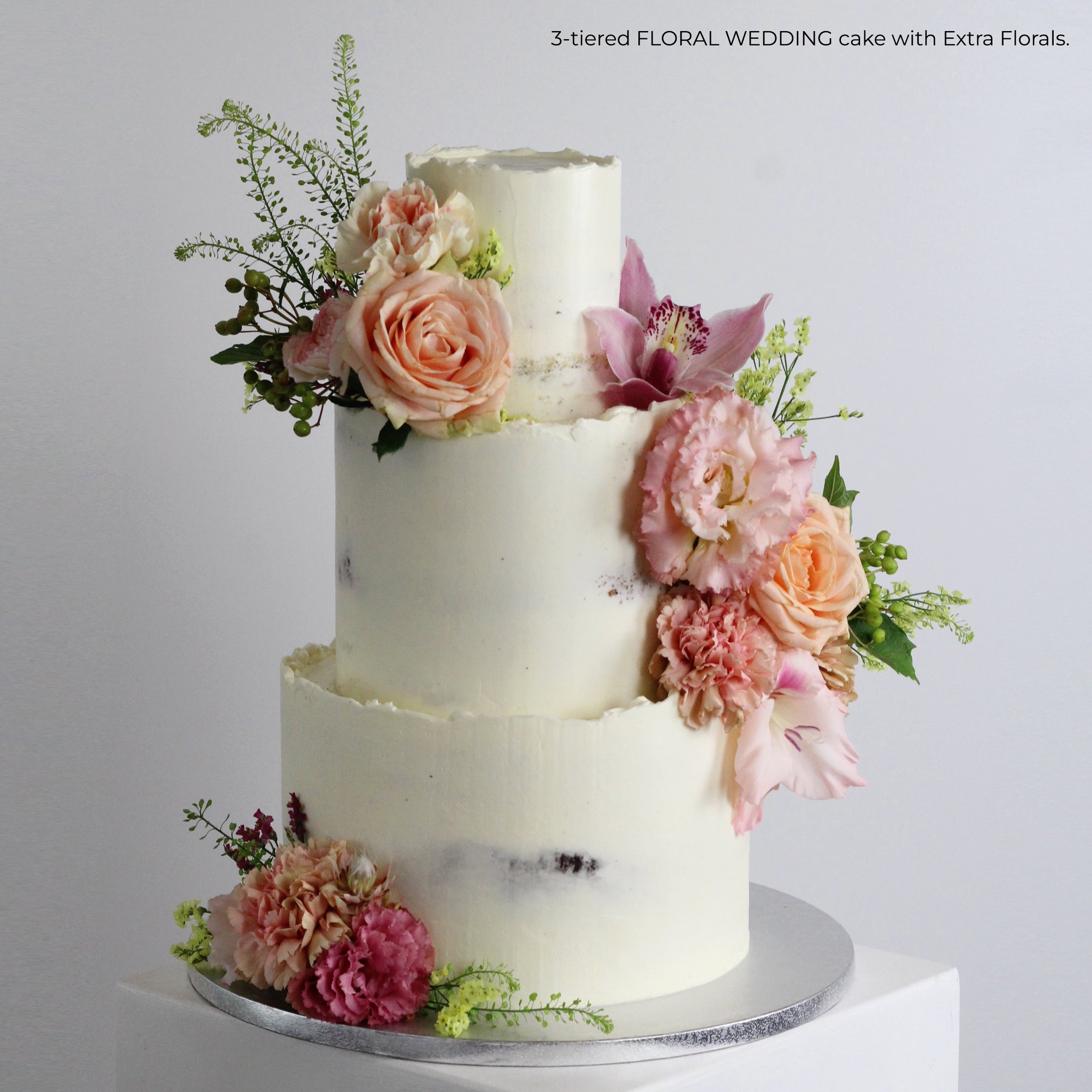 Semi-naked FLORAL WEDDING -decorated with pastel florals. 
Made at our bakery in Kreuzberg - Delivered in Berlin