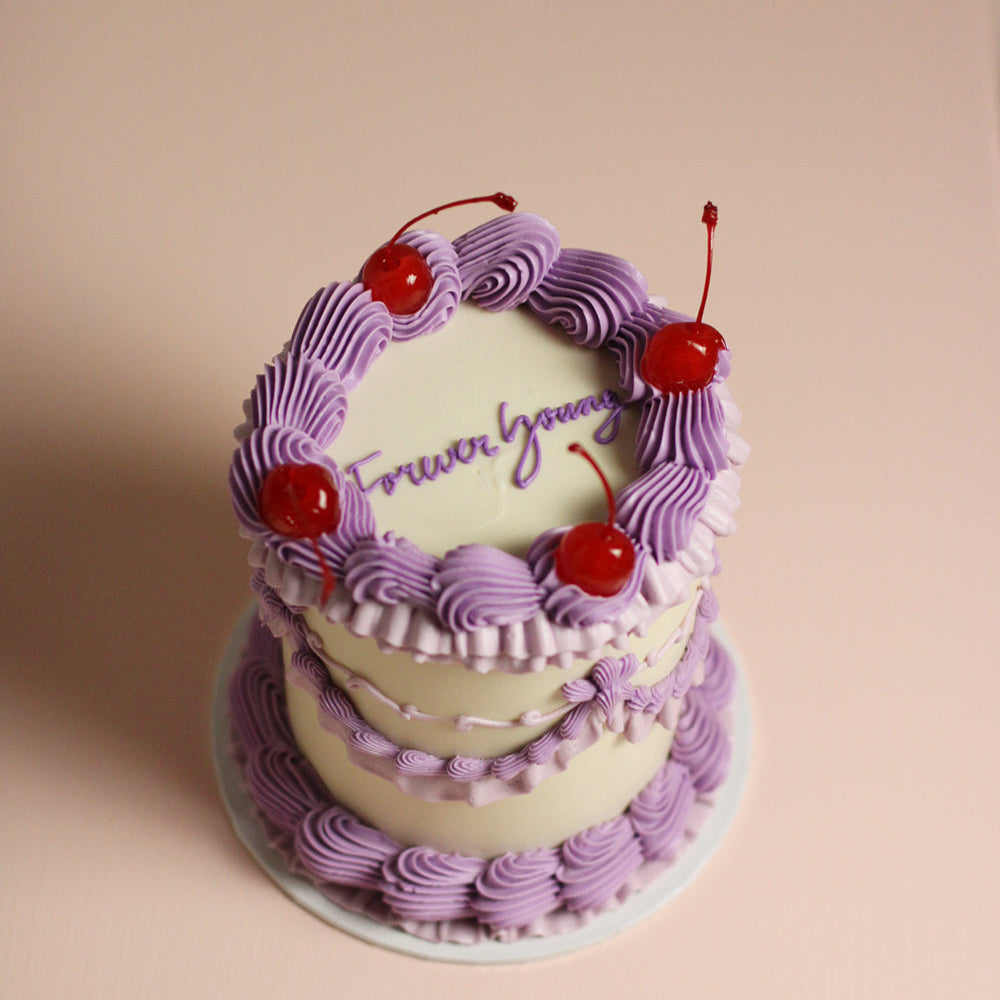 Mini size Antoinette with purple frills and red cherries