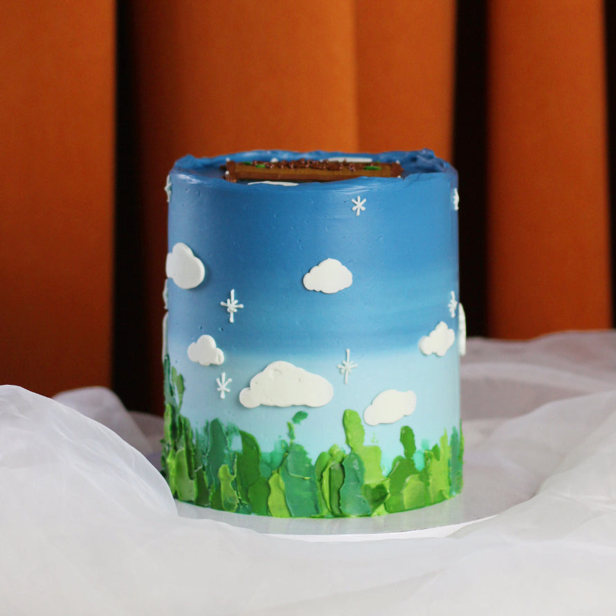 Blue sky, white clouds and green grass! This dreamy cake is for all nature-lovers.