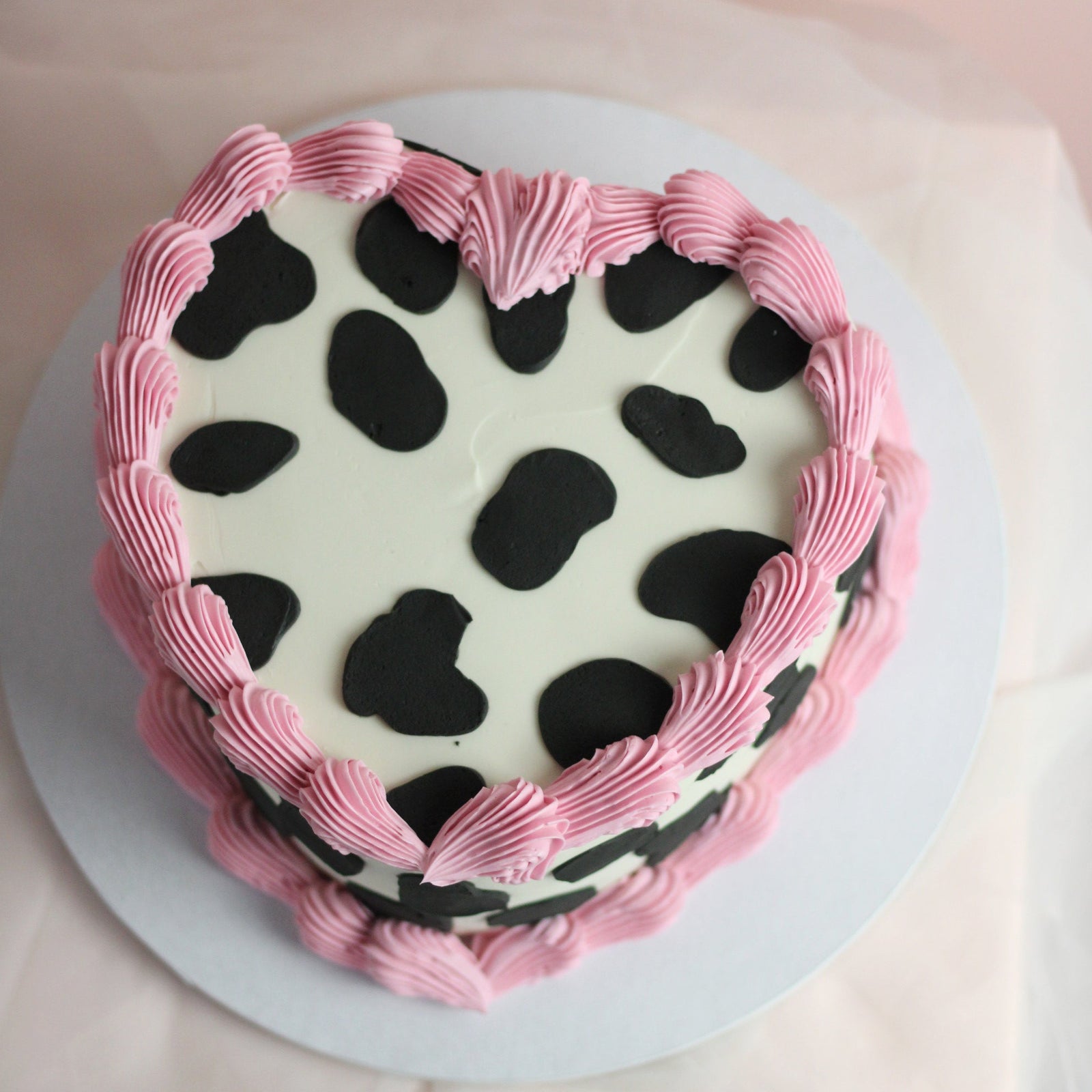heart-shaped cow print Cake with vintage pink frills