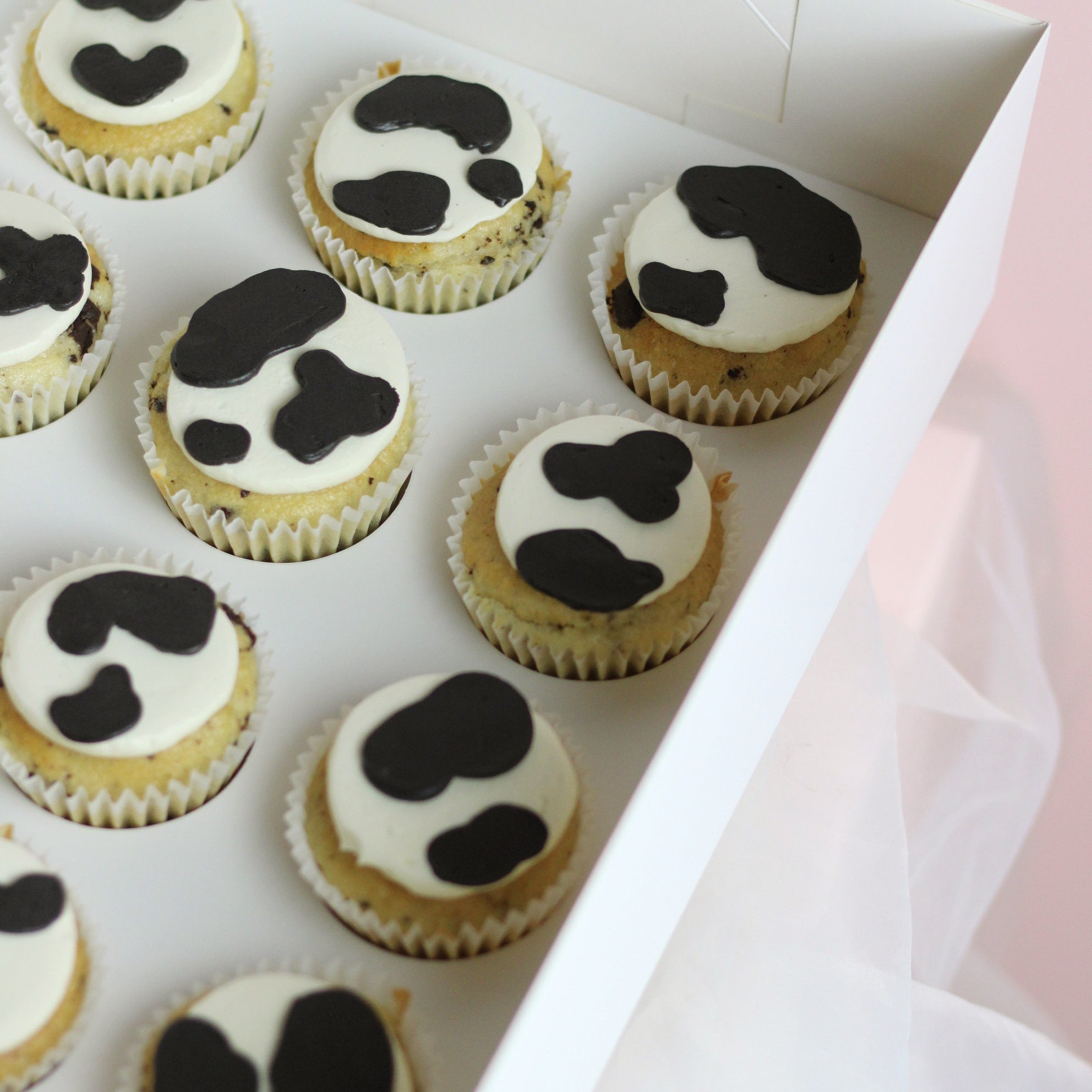Cute cow print cupcakes, ideal for birthdays, parties, or dessert tables, simple design, fun and tasty treats