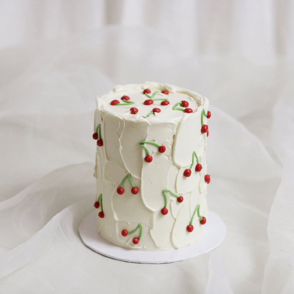 Meet our cherry cake! decorated with textured white base and tiny hand-painted cherries all over it! A bit vintage and a lot cute &lt;3