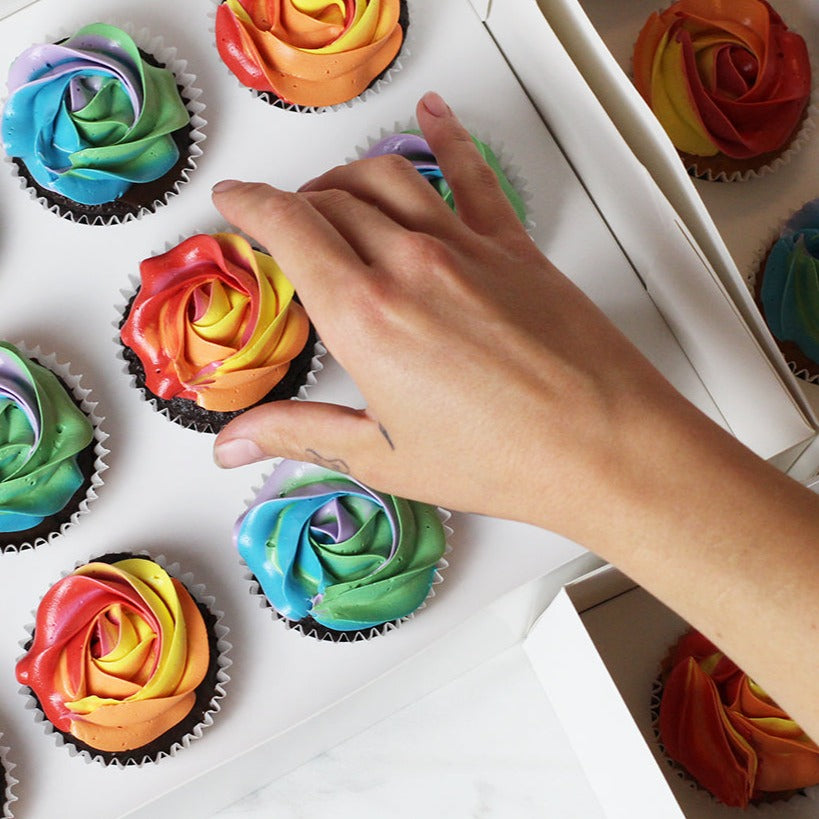 Colorful mini chocolate rainbow cupcakes  - baked fresh in our bakery - to order
