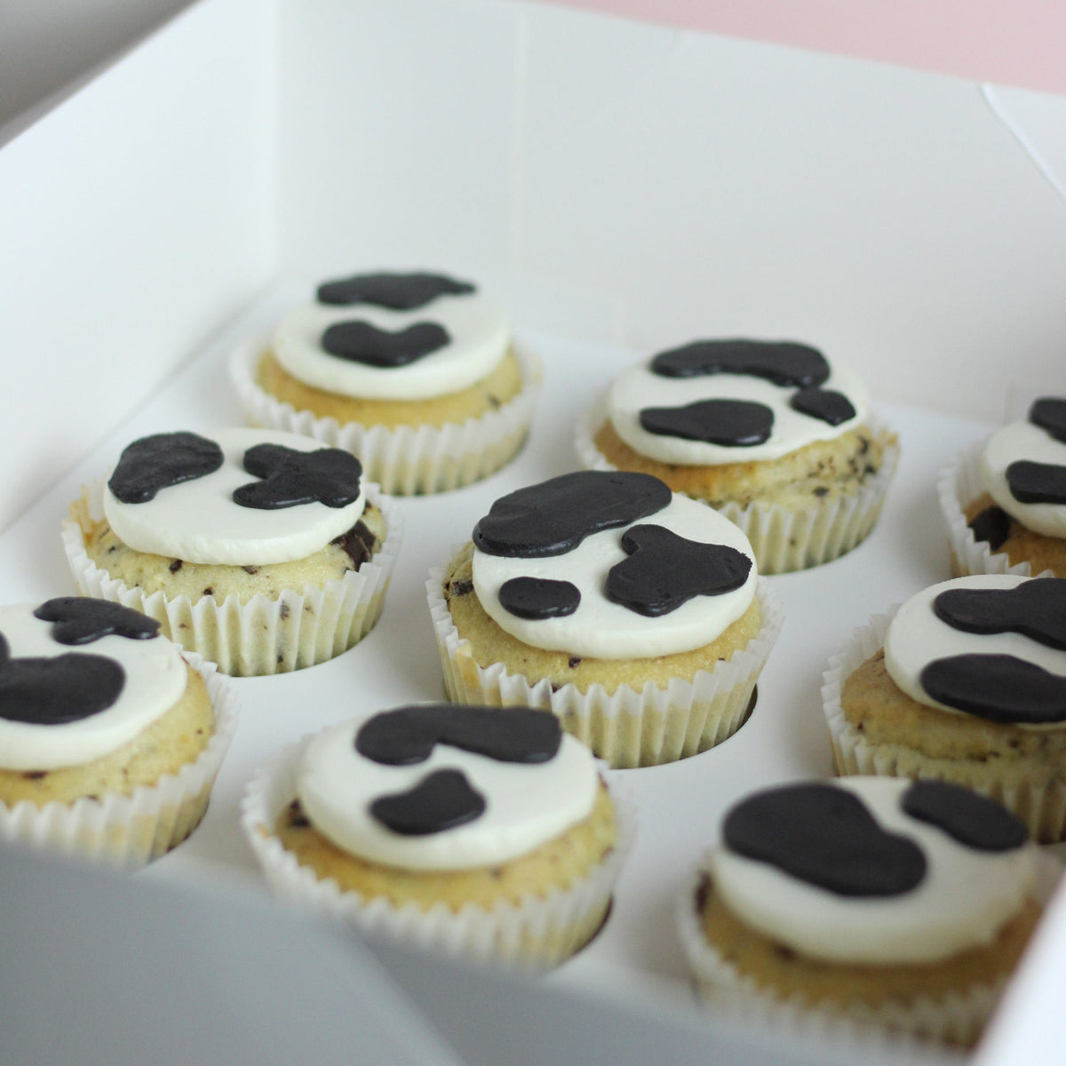 Cute cow print cupcakes, ideal for birthdays, parties, or dessert tables, simple design, fun and tasty treats