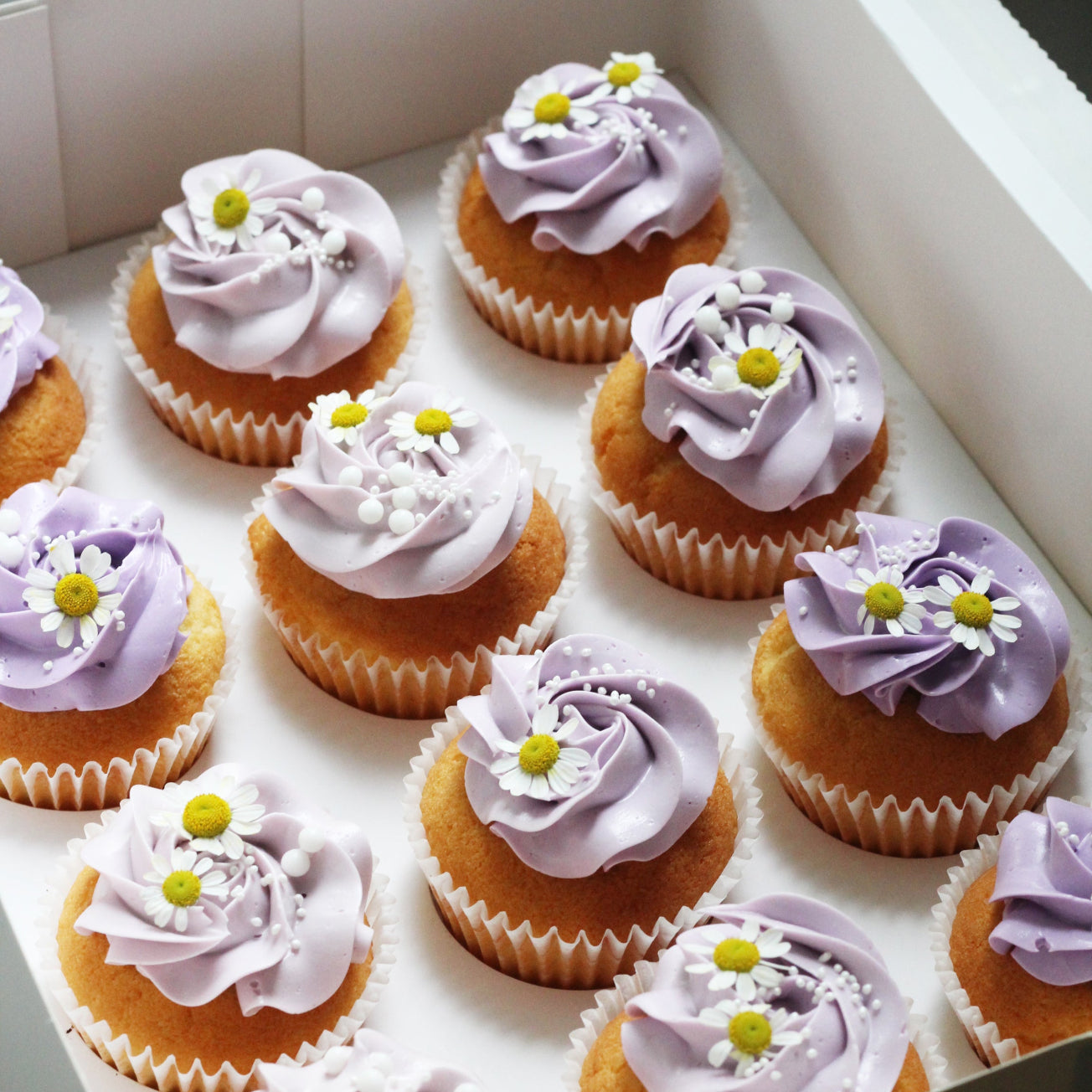 Daisy Days cupcakes with purpule vanilla buttercream