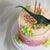 Details of the cake in a gorgeous mix of pink & orange with hints of green.