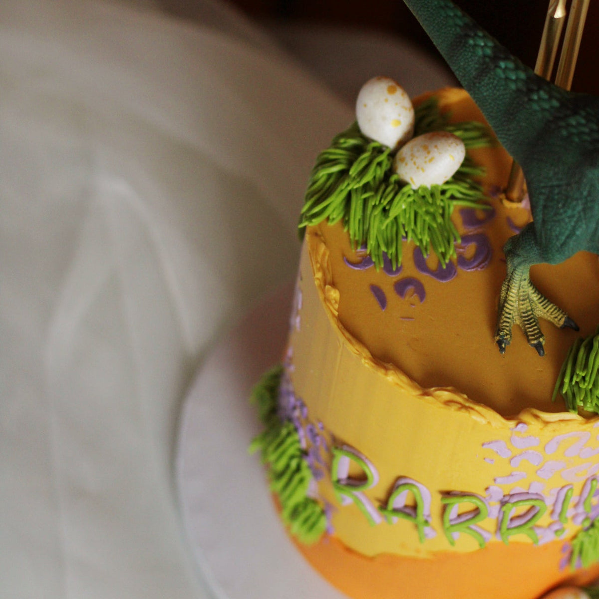 Details of Dino cake in orange
