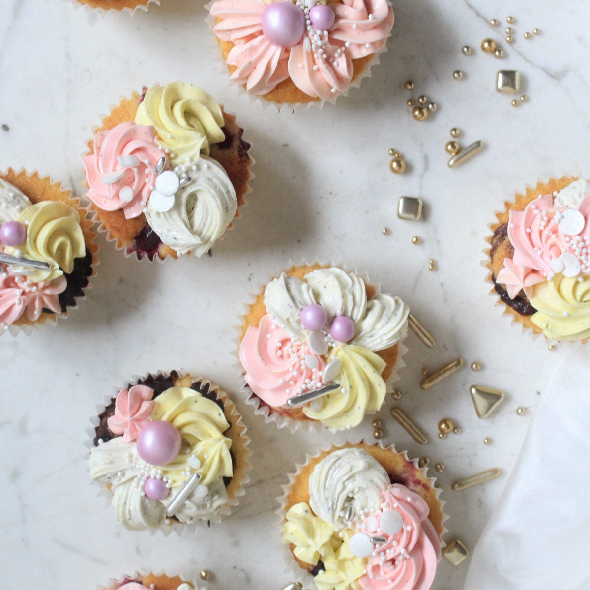 Cupcakes - our smallest sweet treats with pastel mixed buttercream piping!