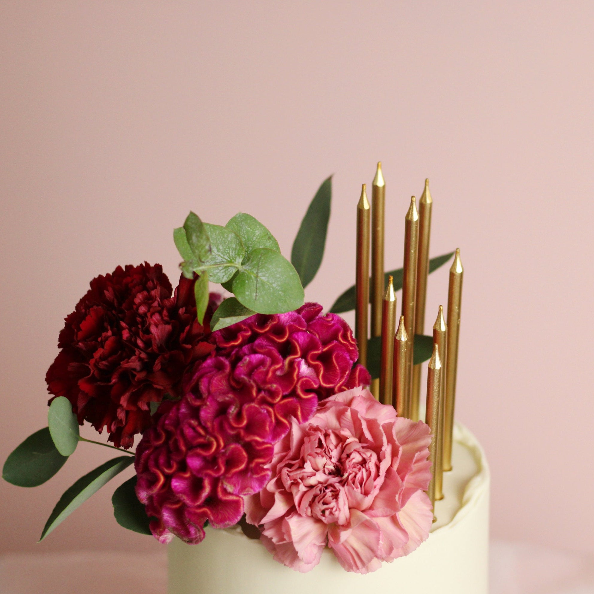 Floral cutie cake - bold florals and gold candles.
Made at our bakery in Kreuzberg - Delivered in Berlin