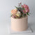 Floral Cutie Cake - Our signature cake with rosé base, adorned with fresh flowers!