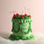 Vintage style frill cake, decorated with green frills and red cherries. Hand-made in our kreuzberg studio - delivered in Berlin