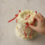 Vintage style white frill cake with little red hearts all over adorned with red silk bows.