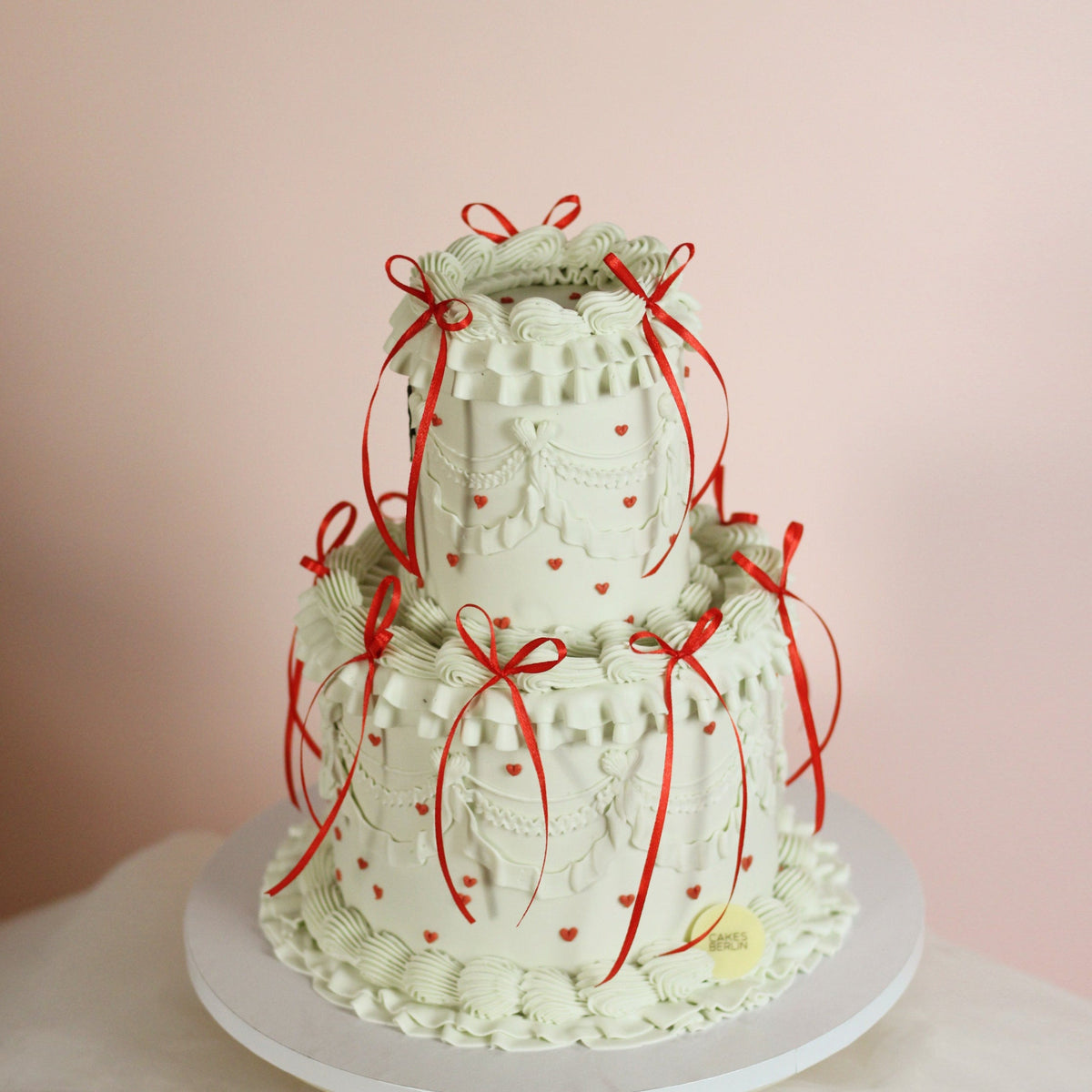 Two tier vintage cake with tiny red hearts and red silk bows - is she perfect, or what?!