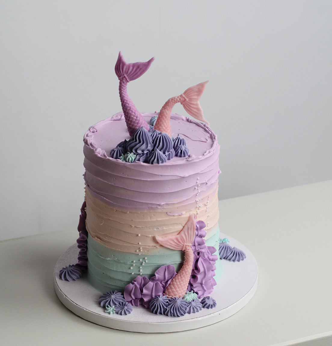 Mermaid underwater cake - decoated with sugar nermaid tails, buttercream reef &amp; and pearls