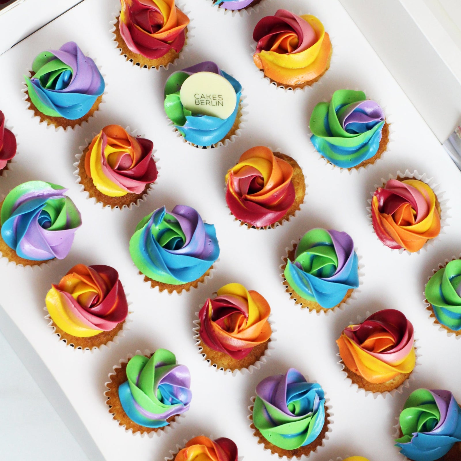 Colorful mini chocolate rainbow cupcakes  - baked fresh in our bakery - to order