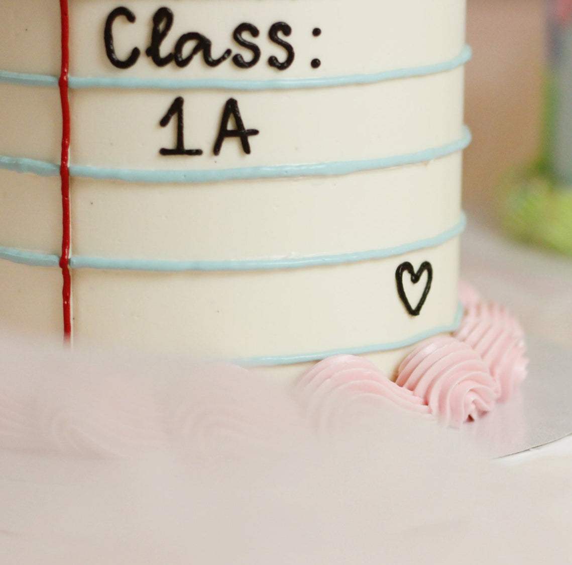 Mark their school start with this custom notebook cake. Designed with classic blue notebook lines, with customizable text for your child’s name and class, all framed by soft vintage piping. The sweetest way to kick off the einschulung