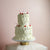 Two-tiered white vintage wedding cake with red cherries - made with love in our Kreuzberg studio, delivered in Berlin