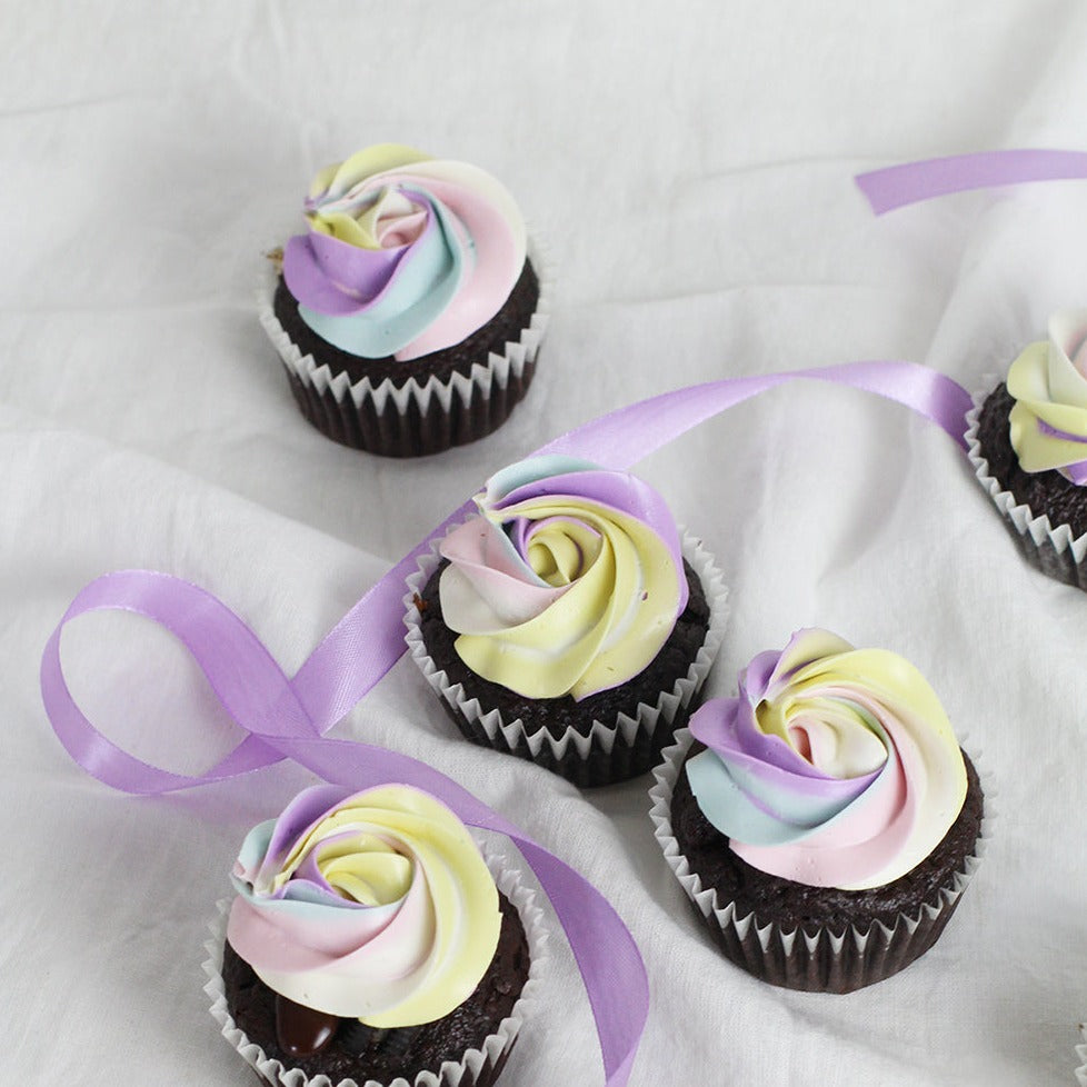 Colorful pastel tone chocolate rainbow cupcakes