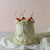 Single-tier vintage cake with red cherries