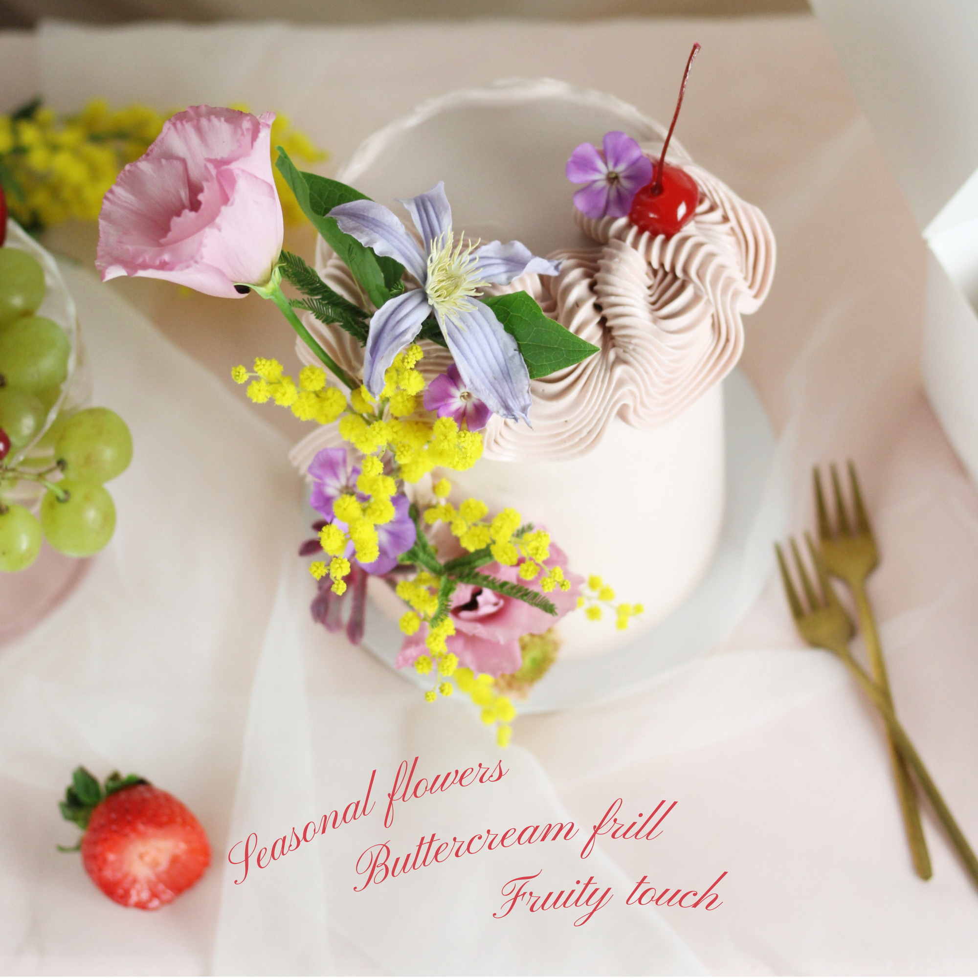 Valentine’s Day cake with light pink buttercream, maraschino cherries, and elegant decorative flowers, ideal for celebrating love.