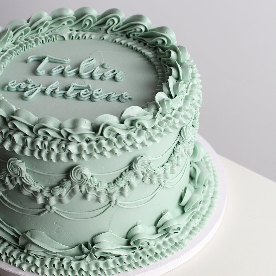 Soft green vintage style cake

Your go-to vintage style cake studio! Meet our sage green frill cake - bake this birthday babe - your own!