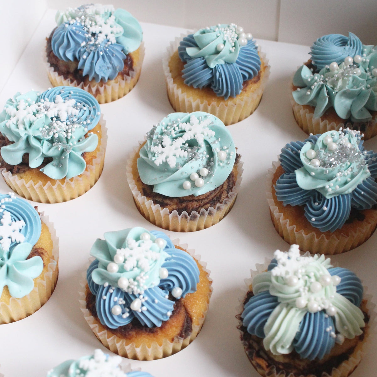 Cupcakes - the small sweet treats with gorgeous blue buttercream piping!