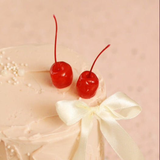 Red cherries and a bow