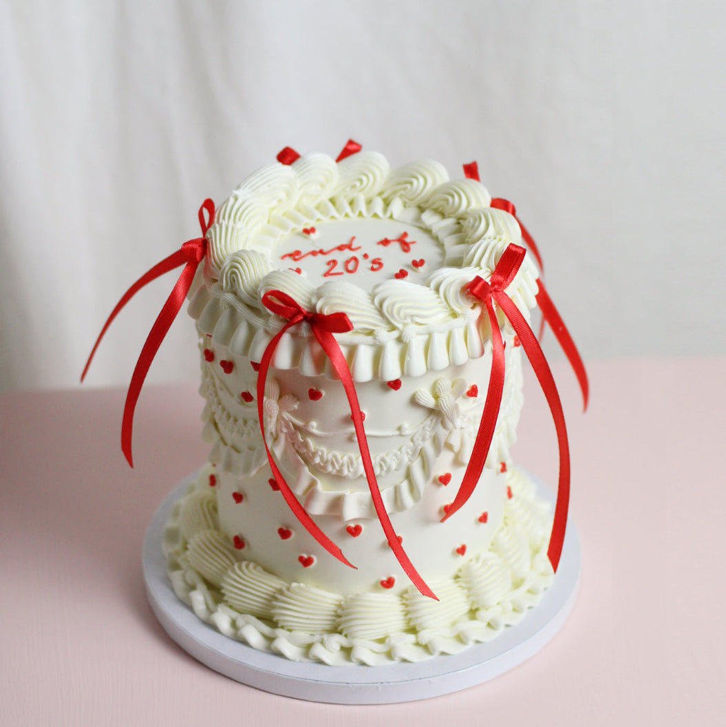 One of our favorite vintage Cake now with red tiny hearts and red silk bows!