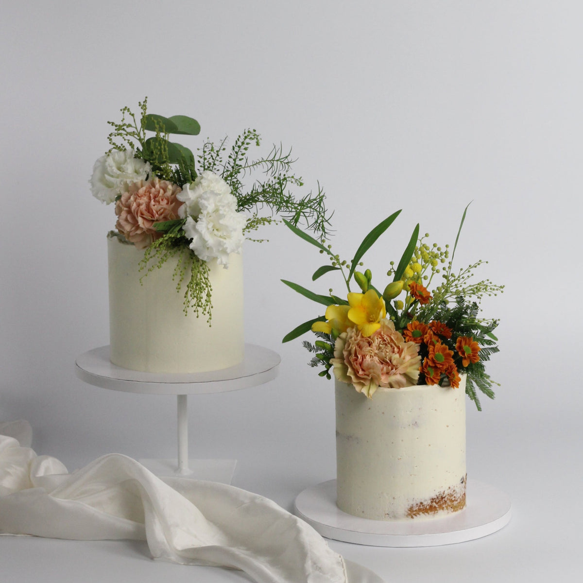 Floral Cutie Cake - Our signature semi-naked cake adorned with fresh flowers!