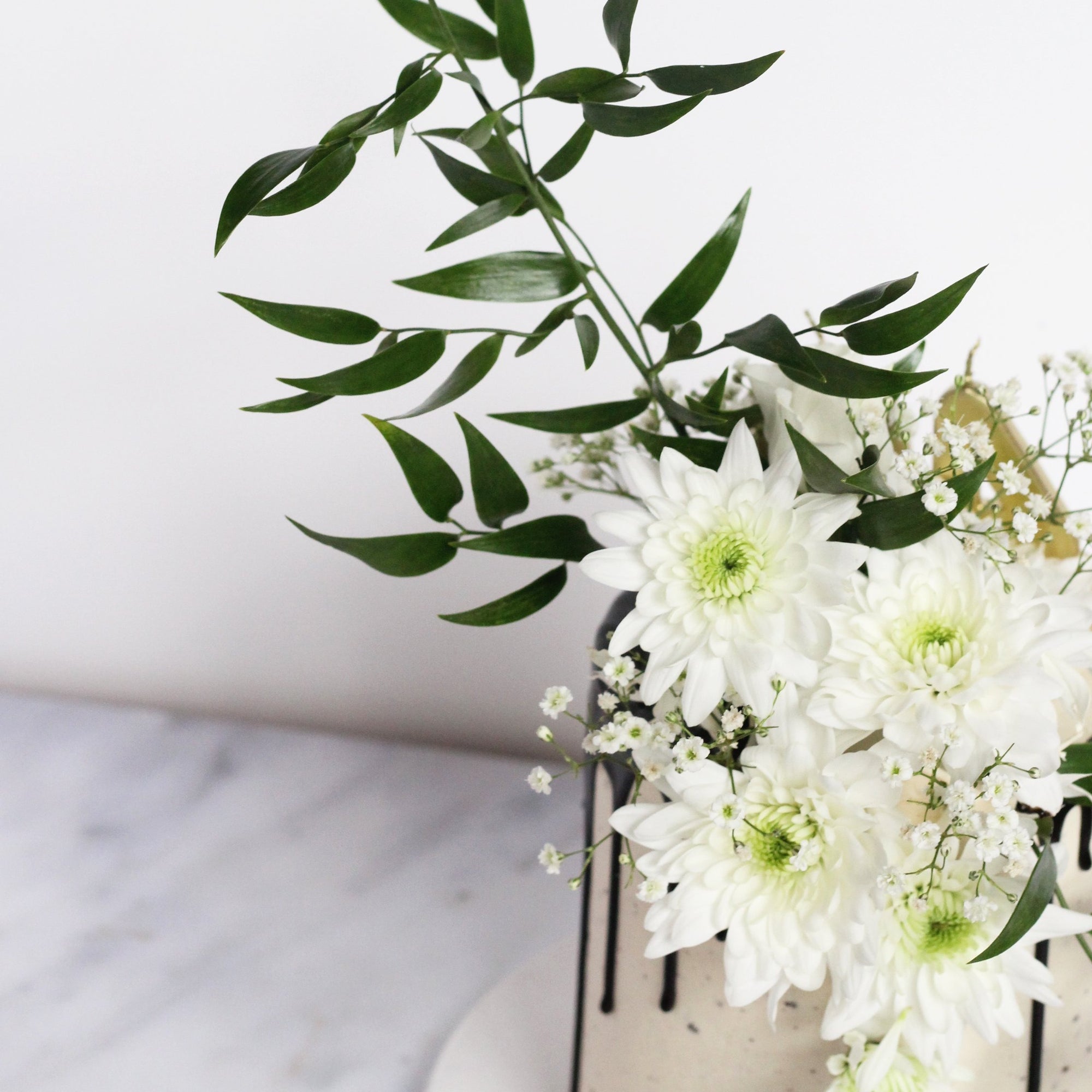 Lady Reserved Cake - chic & simple white icing with dramatic florals & greens.