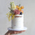 CakesBerlin´s signature seasonal florals semi-naked cake