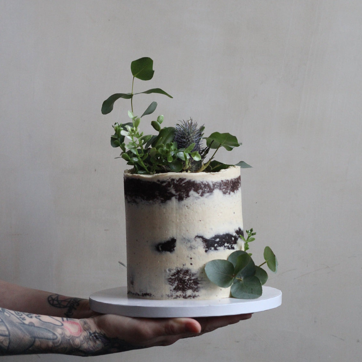 Forest Fairy Cake - Our signature semi-naked style adorned with Eucalyptus &amp; your favorite greens!