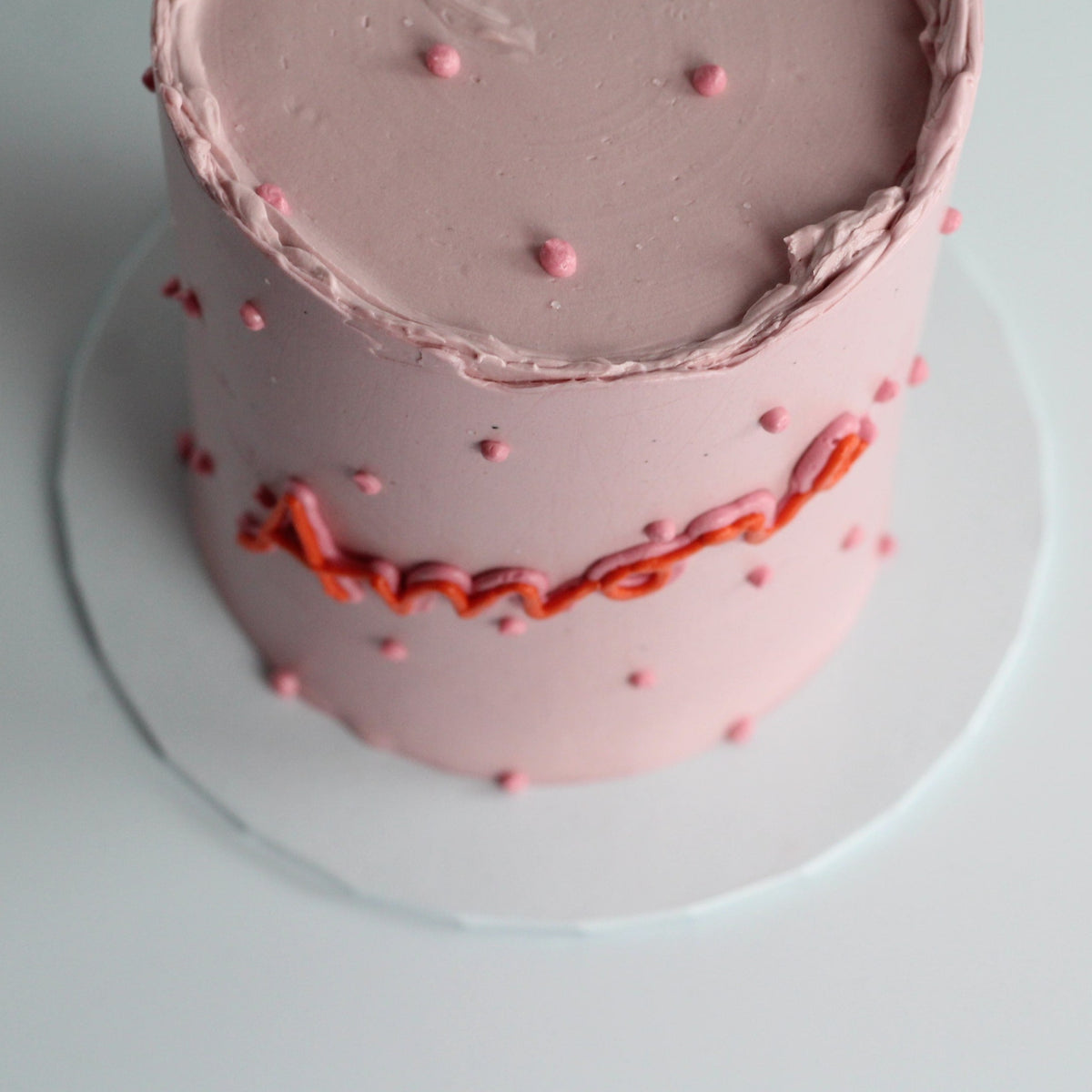 Celebrate love with our pink AMORE cake!