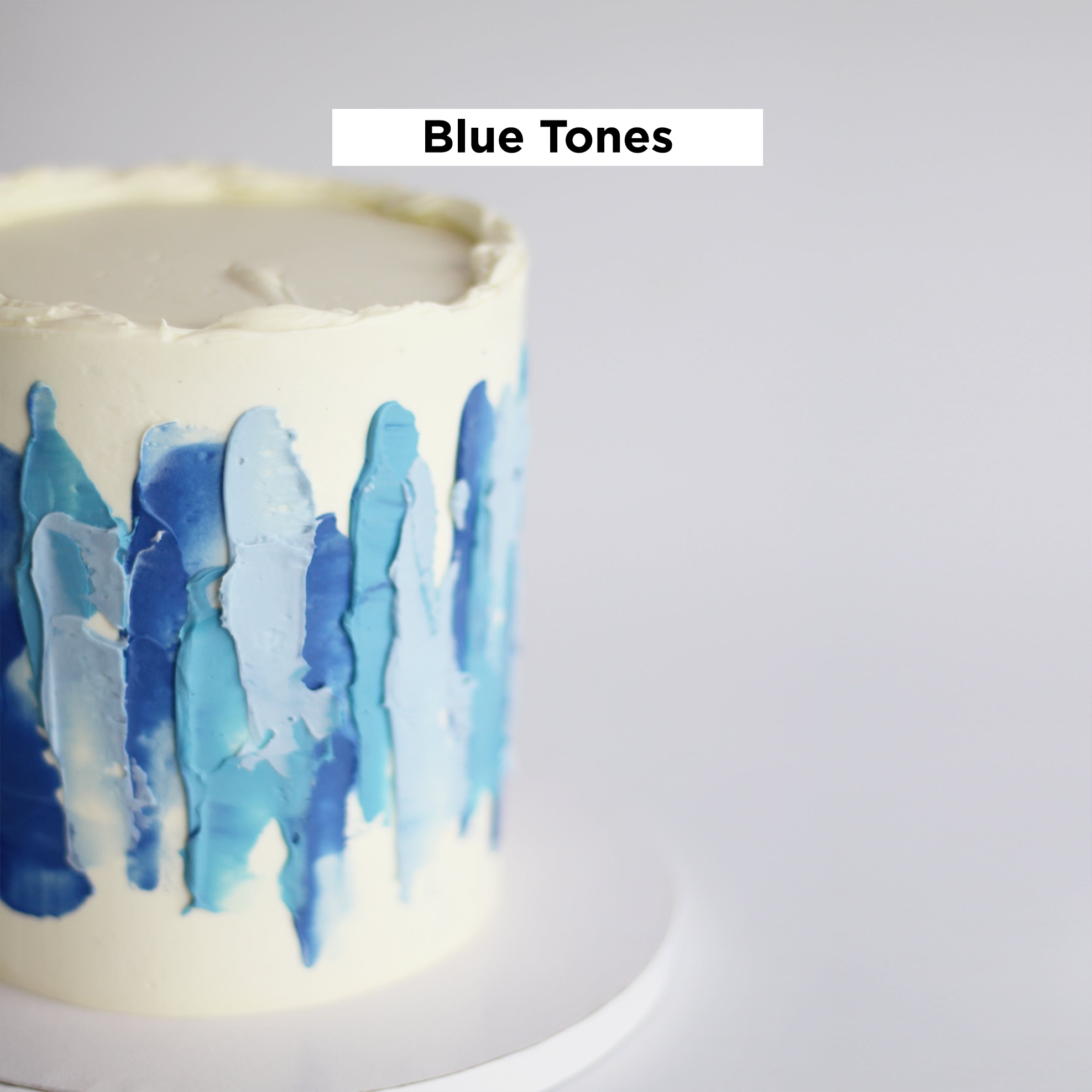 Our signature LUIZA cake adorned with abstract strokes in blue tones.