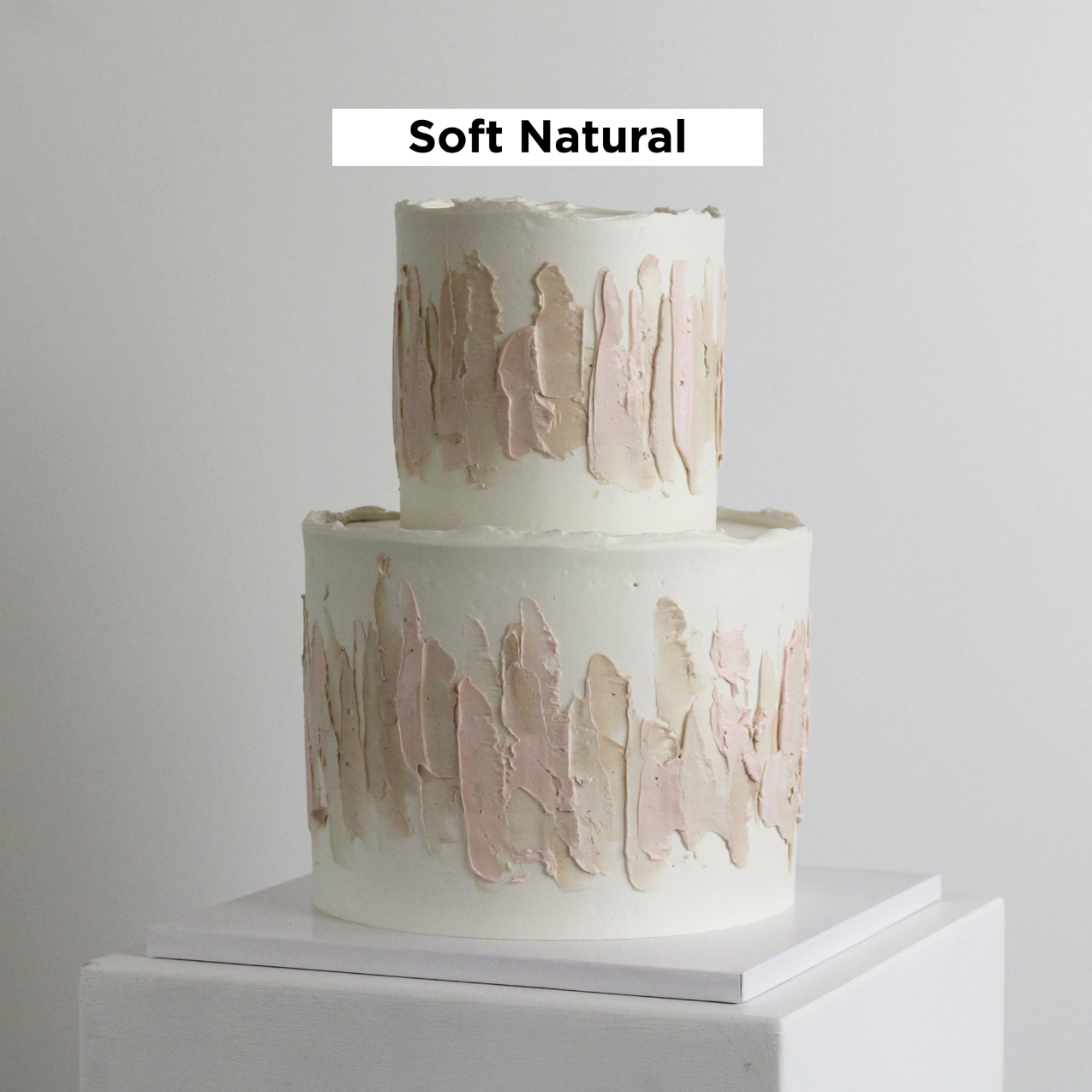 Our signature LUIZA cake adorned with abstract strokes in soft natural tones.
