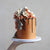 Our signature Shag Cake in warm tones, covered in shaggy buttercream!