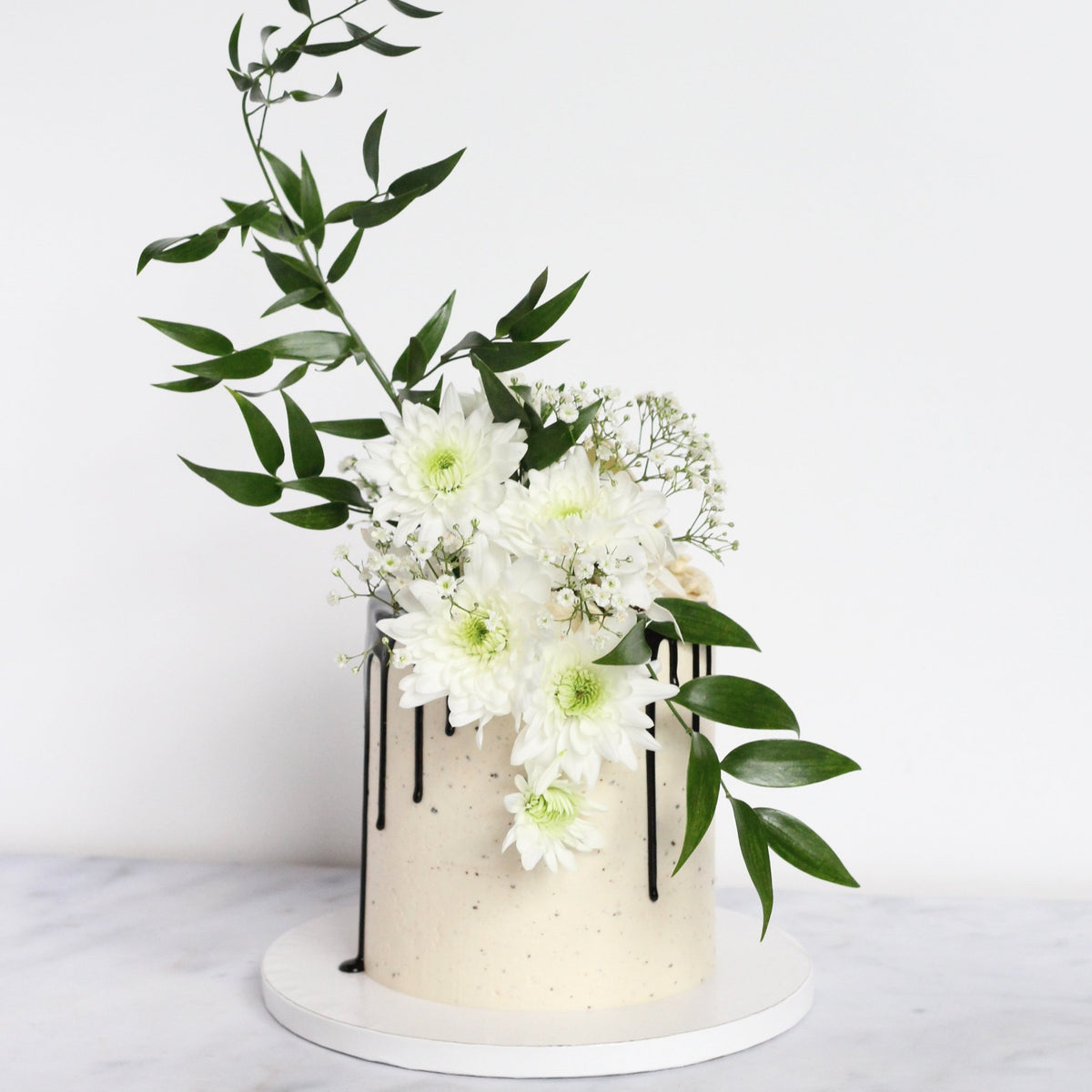 Lady Reserved Cake - chic &amp; simple white icing with dramatic florals &amp; greens.
