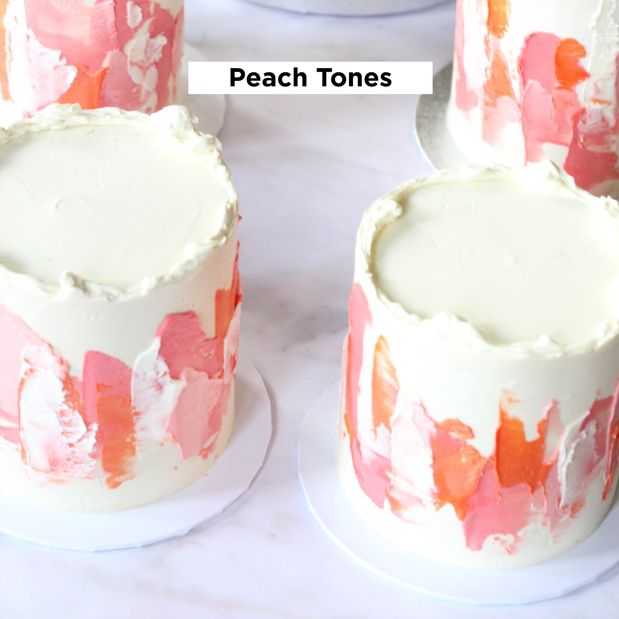Our signature LUIZA cake adorned with abstract strokes in peach tones.