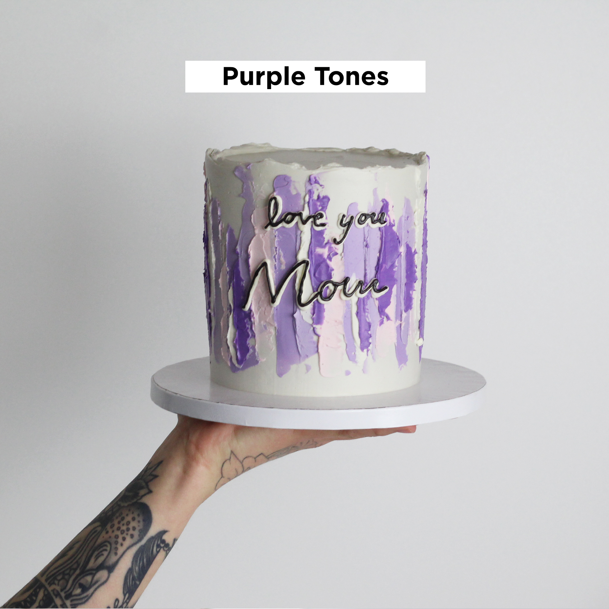 Our signature LUIZA cake adorned with abstract strokes in purple tones.
