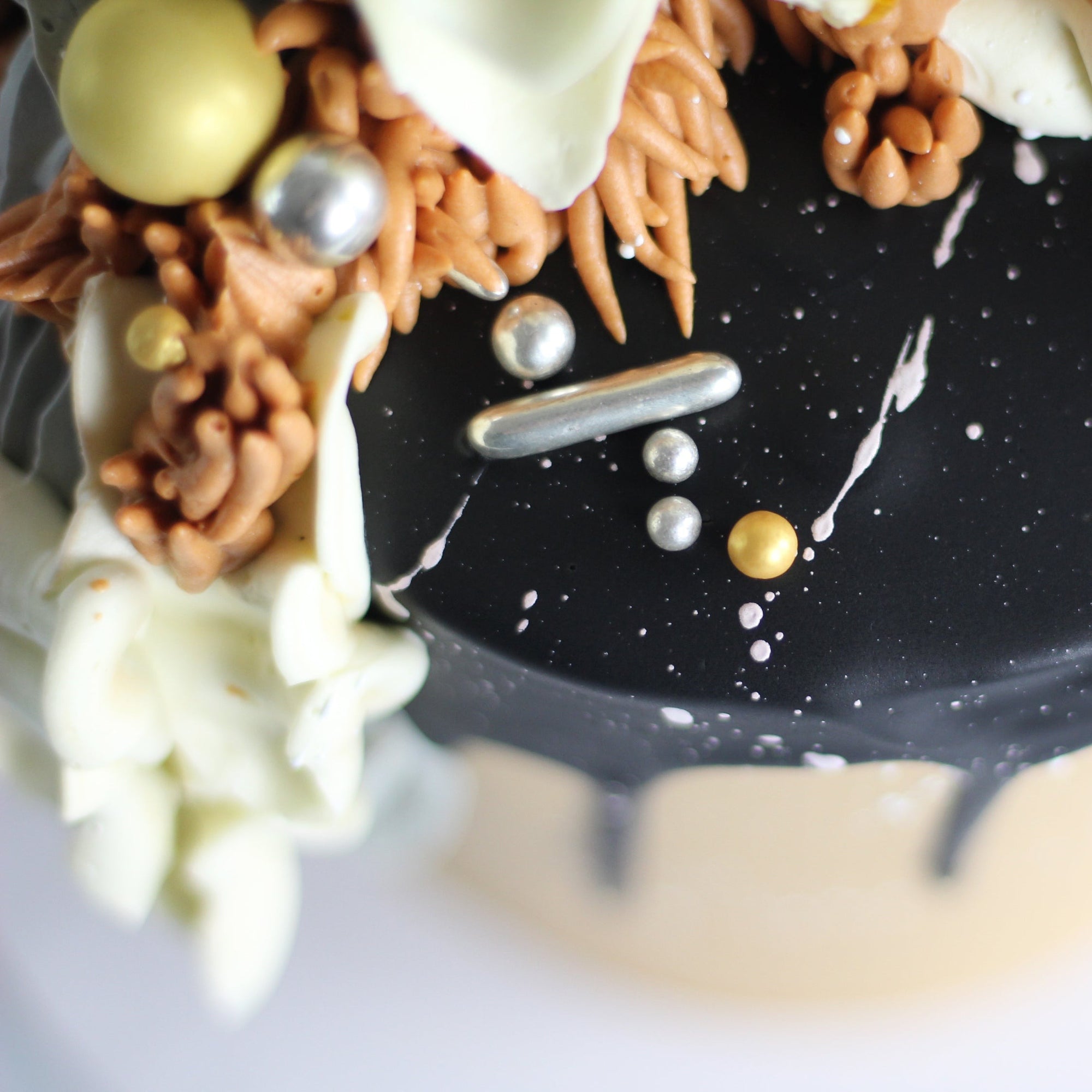 Our signature Shag Cake in warm tones, covered in shaggy buttercream!